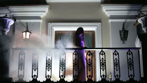 girl in the smoke on the balcony