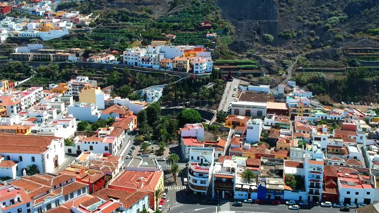 Aerial drone footage of the natural pools of Garachico Caletón. Blue ocean and the natural pools functioning as playas at Tenerife. Nice waves hit the rocks in the water.