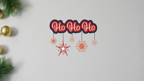 Animation-of-christmas-greetings-text-over-christmas-decorations