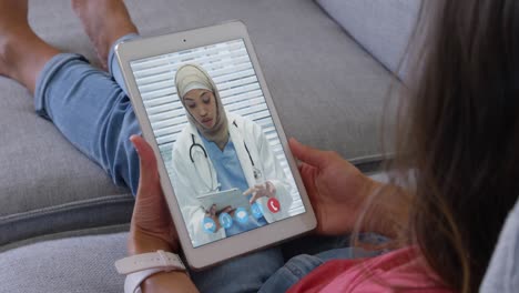woman talking on video meeting on her digital tablet
