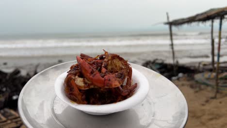 Close-up-shot-of-spicy-red-crab-prepared-in-a-beach-in-Digha,-India