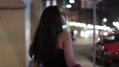 Young-Woman-Jumping-And-Dancing-Around-The-Street-At-Night