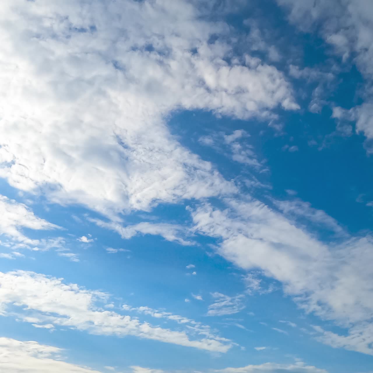 Dense spindrift cloudscape covering the skyline disappear in the wind quickly. Blue skies clearing timelapse. Low angle view