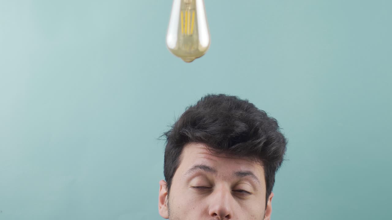 The bulb lights up above the man's head when he gets an idea.