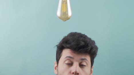 The bulb lights up above the man&#039;s head when he gets an idea.