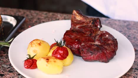 grilled steak with roasted potatoes and cherry tomatoes