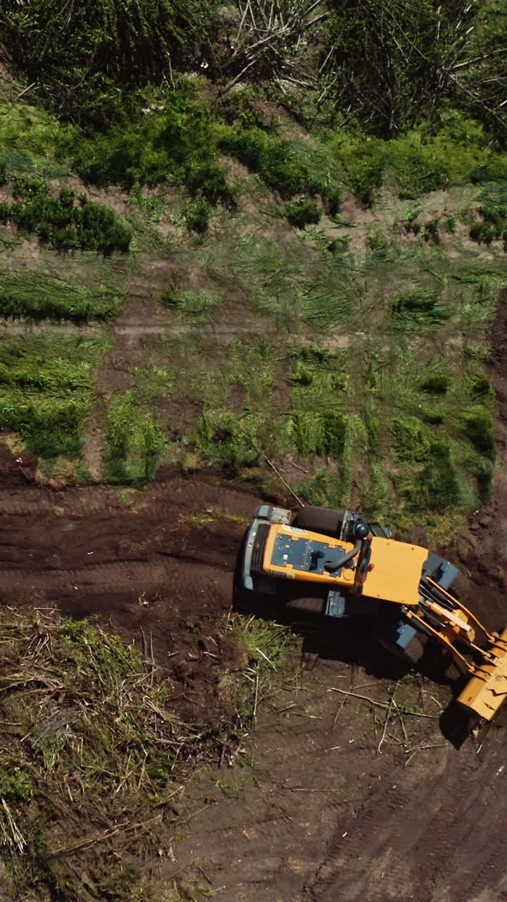 Bulldozer working on field. Top down view of excavator machine on field