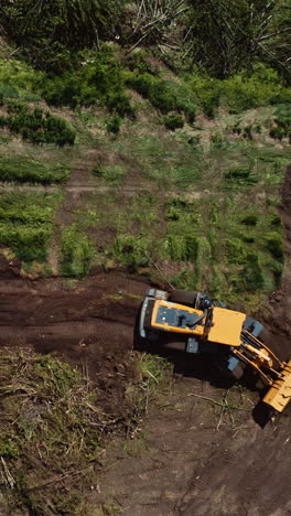 bulldozer working on field. top down view of excavator machine on field