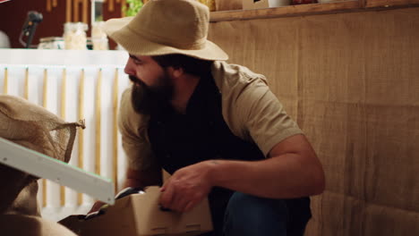 farmer refills supermarket with veggies