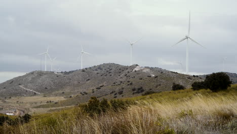 wind turbines generate energy on a cold windy day