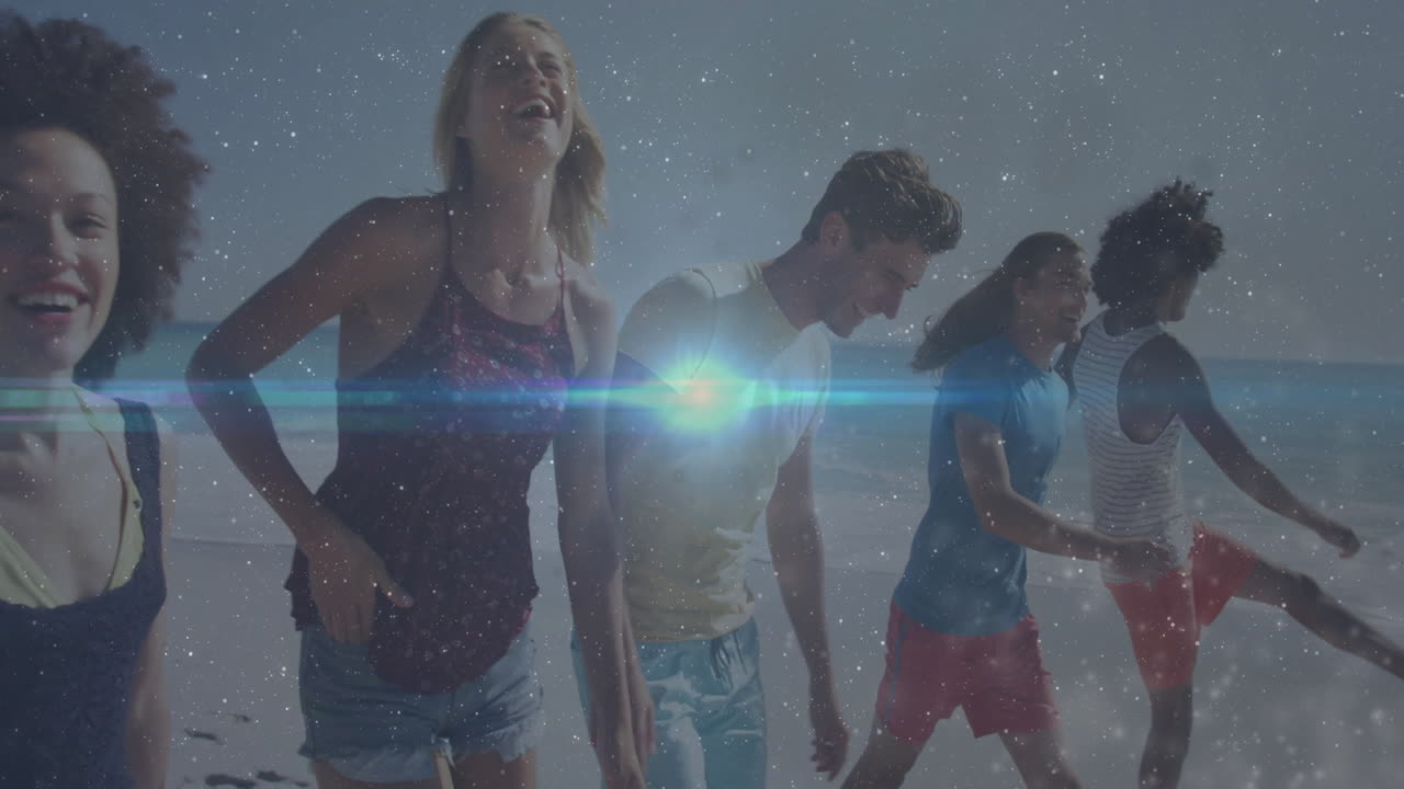 Four friends running along beach, with lens flare and starfield overlay boosting marketing visuals