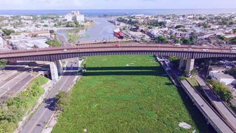 Drone-shot-of-overgrown-vegetation-covering-the-Rio-Ozama-river-in-sunny-Dominican-republic