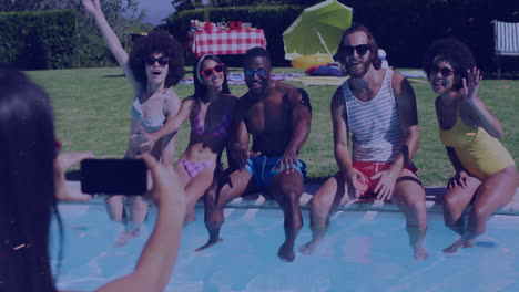 sitting by pool, group of friends posing for photo, enjoying sunny day