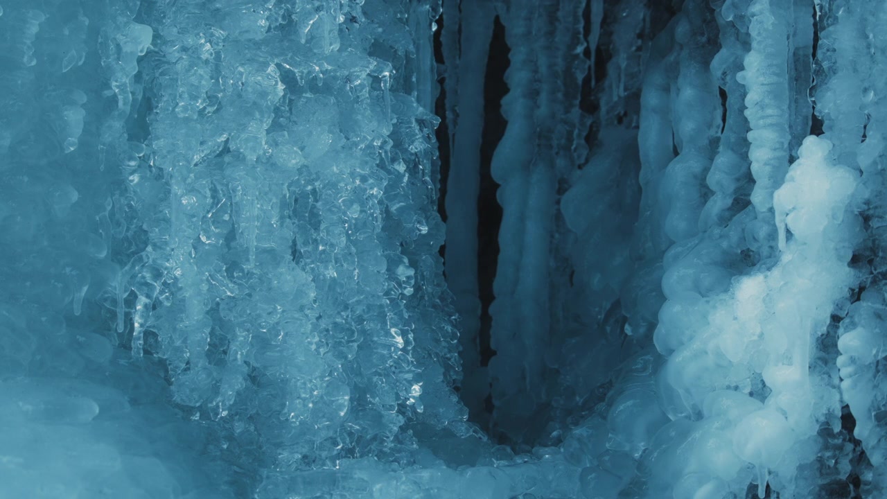Icicles of frozen waterfall melting