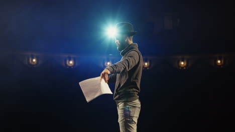actor reading script on stage