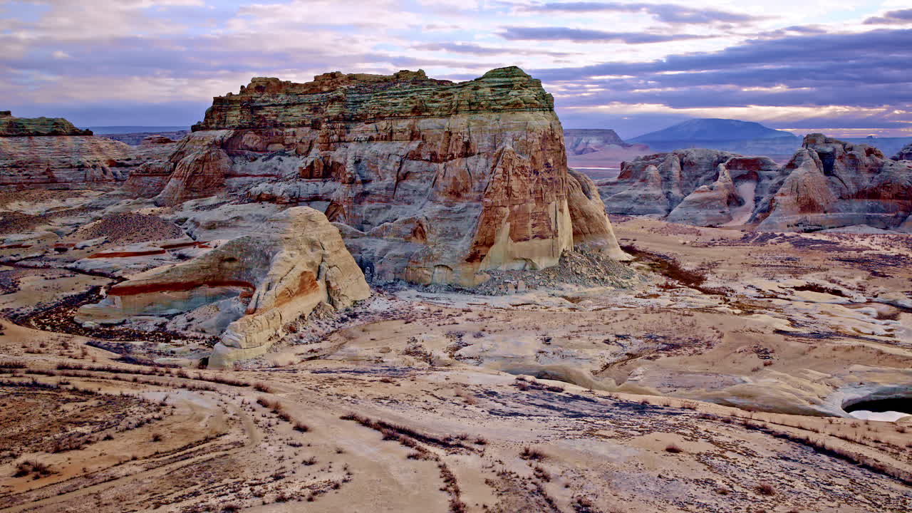 A mesmerizing high-angle drone shot emphasizing the natural artistry of the red rock formations near Lake Powell.