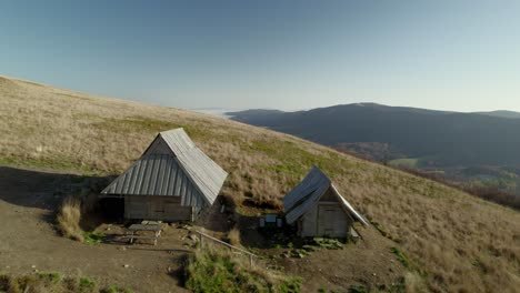 Aerial-view-of-two-mountain-shelters-in-the-Bieszczady-National-Park-in-Poland