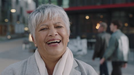 close-up-of-senior-business-woman-laughing-portrait-of-professional-indian-woman-happy-proud