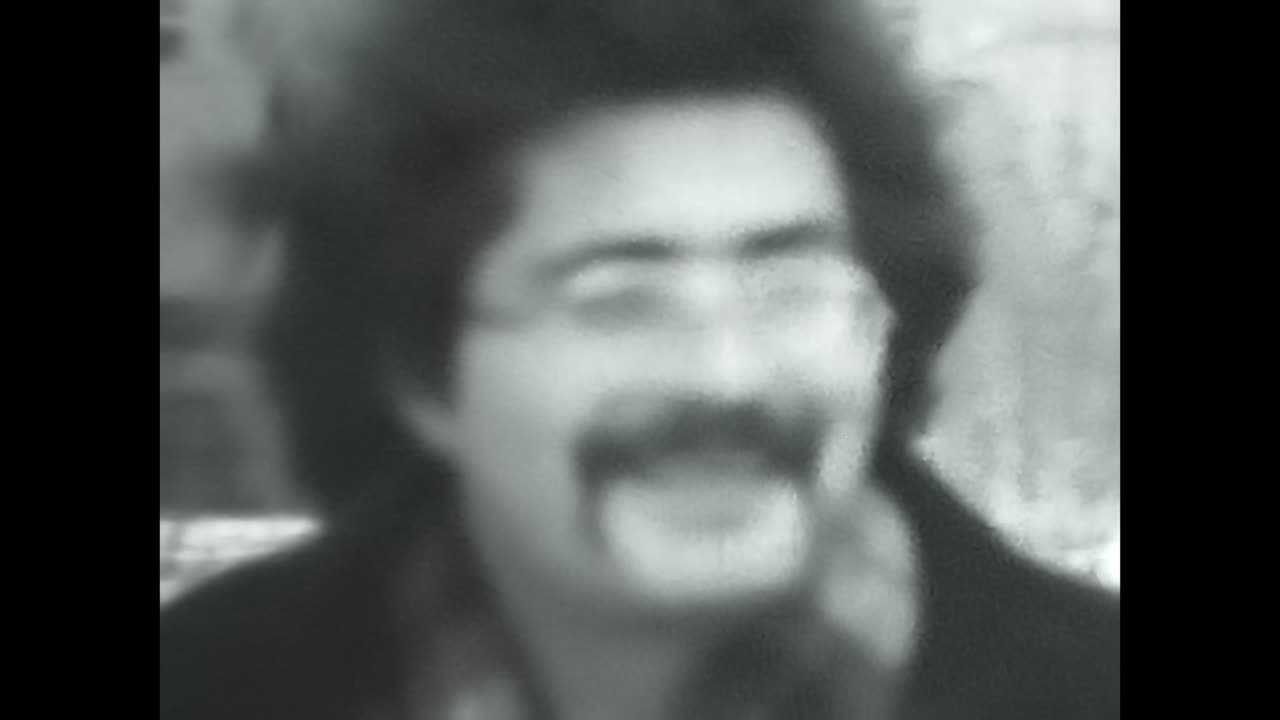 Men Walking in the Snow, Soviet Union Archive Video. CIRCA USSR 1980s: A black and white video capturing men walking through the snowy landscape of the Soviet Union.