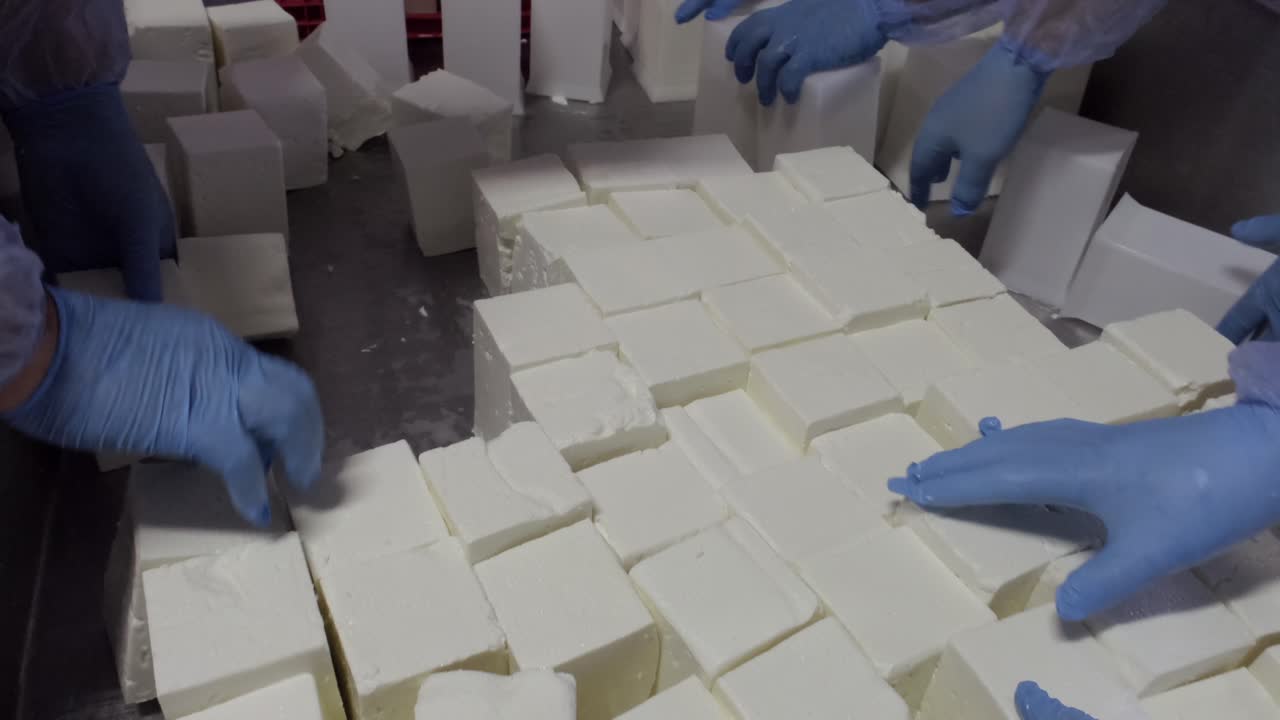 Hands arranging cheese crowd production