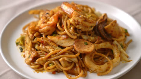 stir fried tom yum seafood dried spaghetti - fusion food style