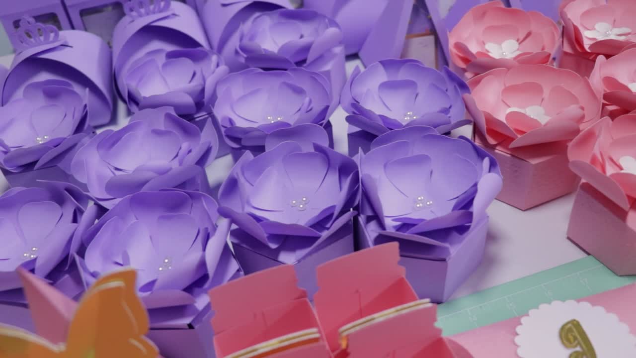 Collection of candy boxes in pastel tones with elegant gold details