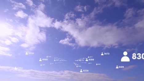 Animation-of-people-icons-with-data-processing-moving-quickly-over-blue-cloudy-sky