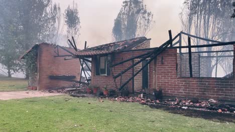 smoke is coming from a house with no roof