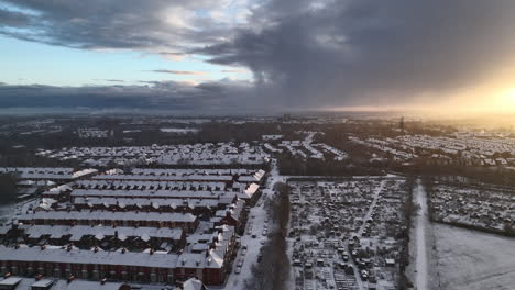 Aerial-of-snow-covered-houses-in-North-East-England,-Newcastle-Upon-Tyne-as-the-sun-rises