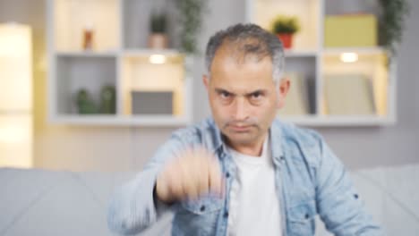 man making stop sign for camera.