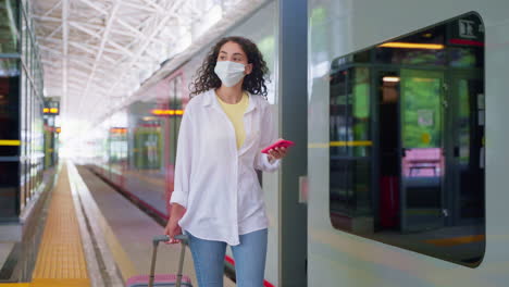 woman traveling by train during pandemic