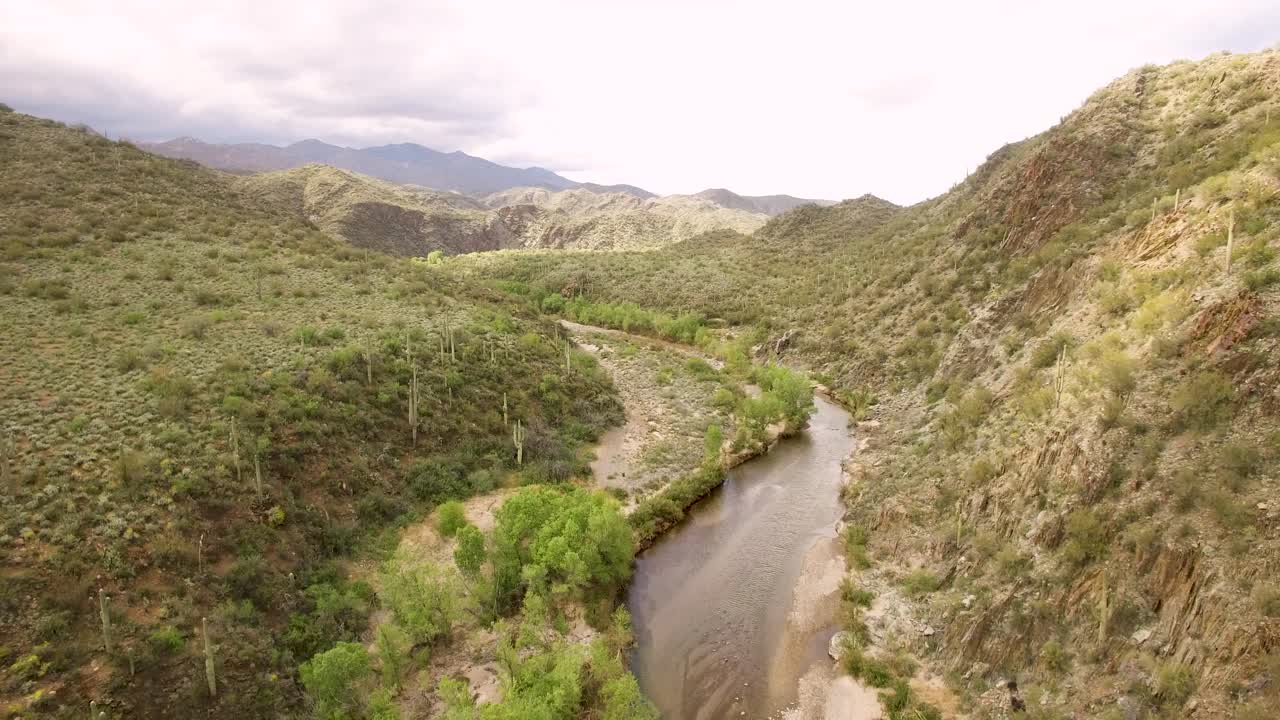 A slow aerial descent into a desert canyon where the Aqua Fria River travels, Arizona