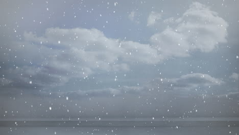 animation of snow falling in seamless loop over clouded sky in background