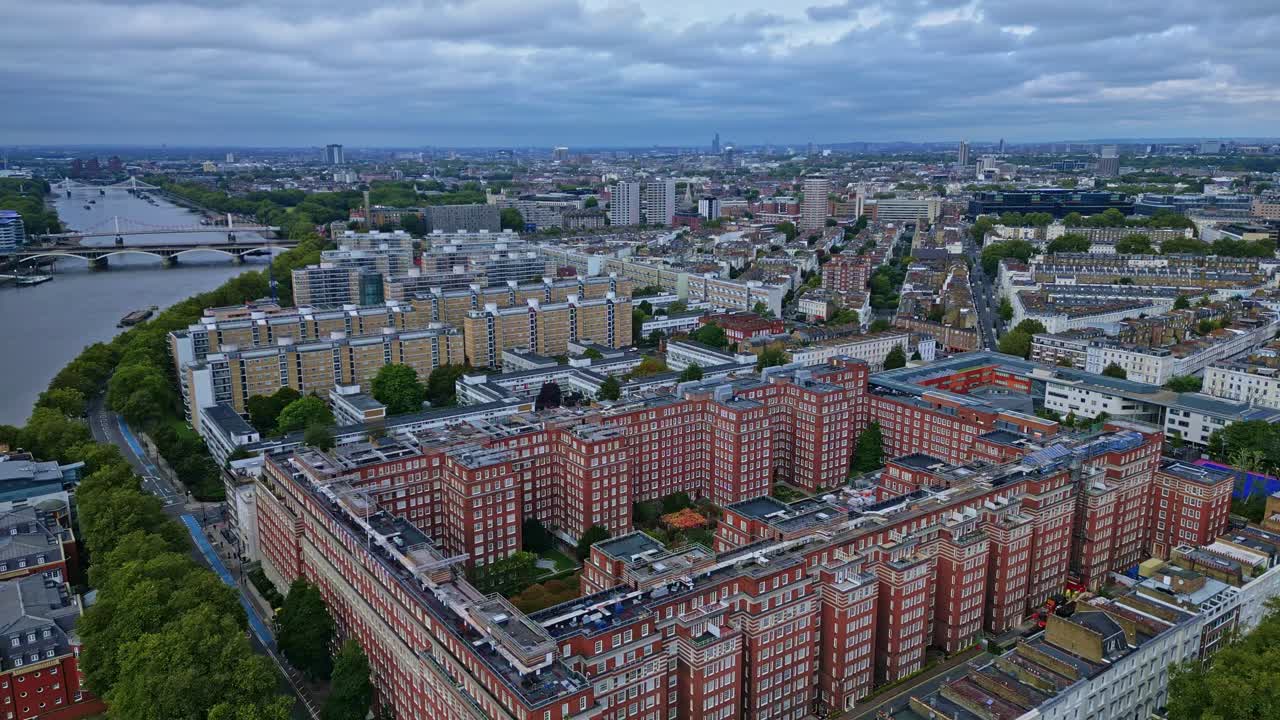 Receding aerial drone movement about the Dolphin square with St. George's and Chelsea bridge with Grosvenor, London, England.