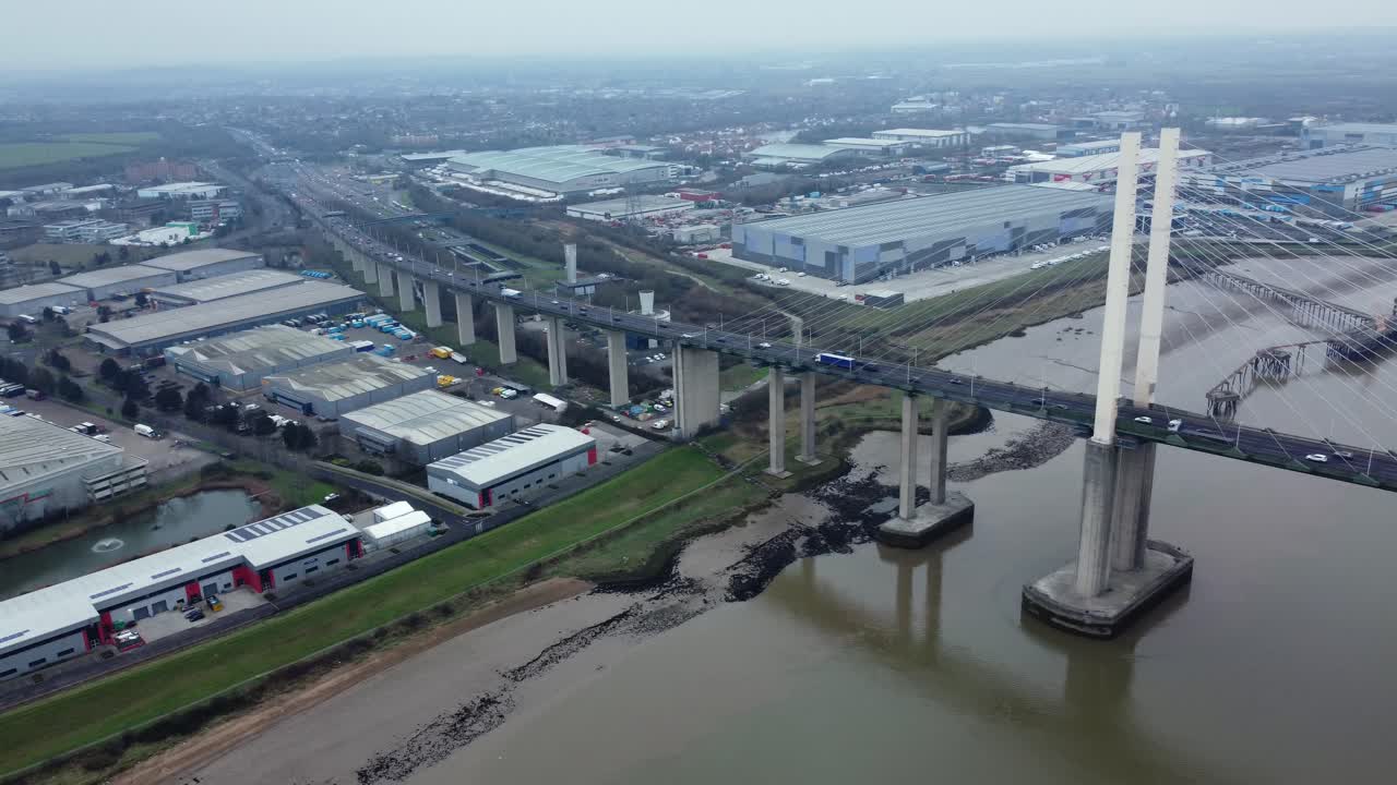 Aerial View of a Cityscape with a Large Bridge Over a River