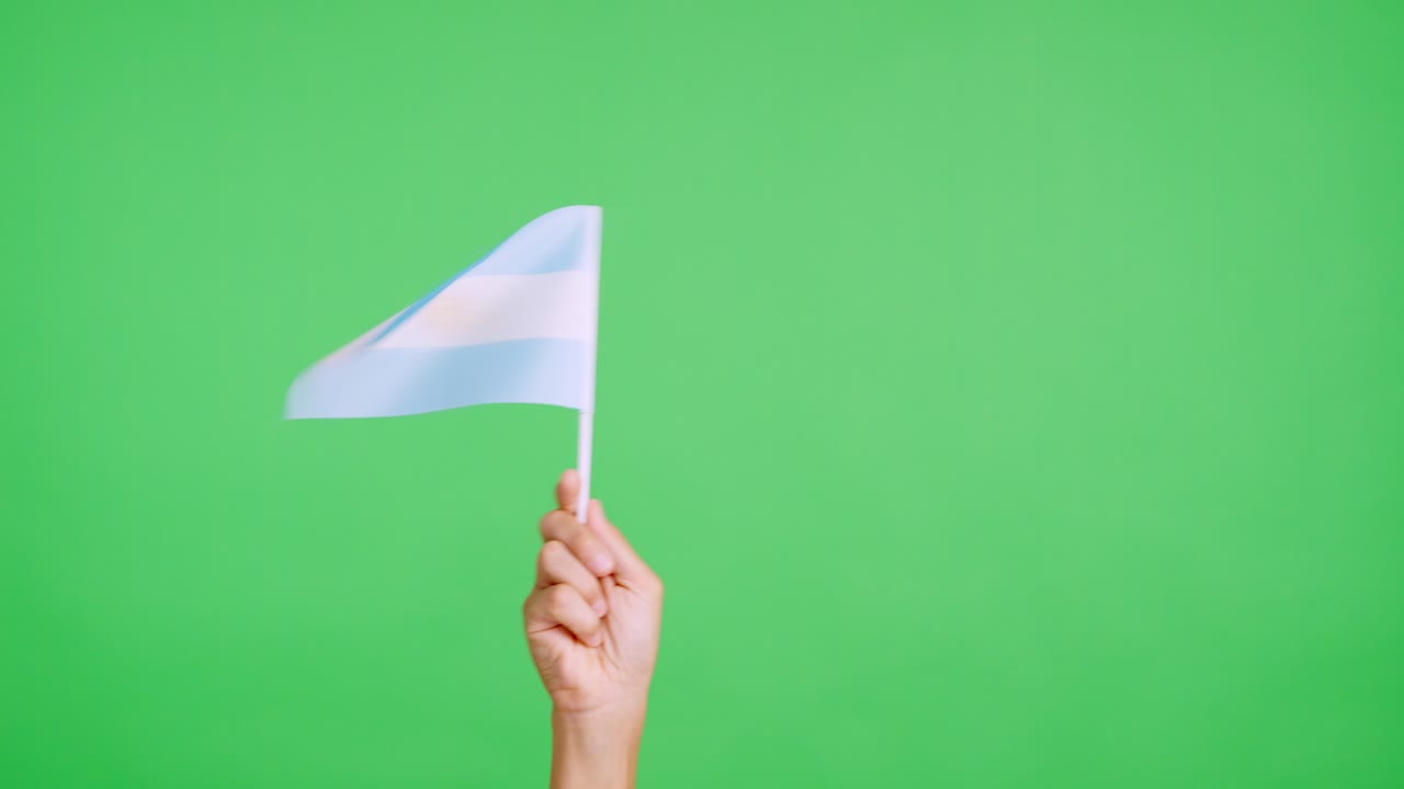 Hand waving a pennant of a argentine national flag