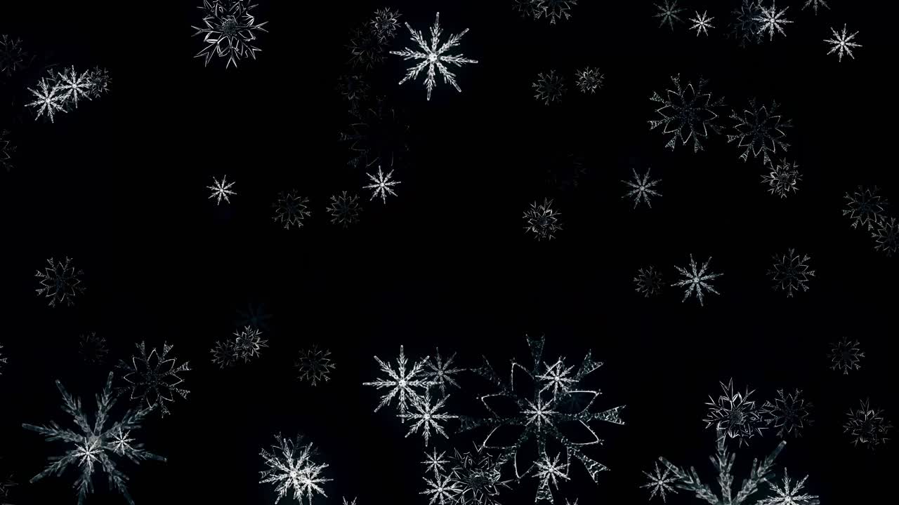 Fallende snøflak på svart bakgrunn