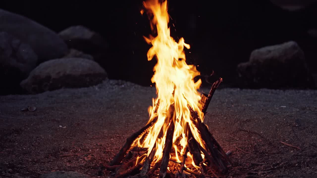 Close up of campfire burning in slow motion.