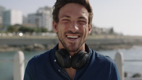 portrait-of-attractive-young-man-laughing-cheerful-enjoying-relaxed-sunny-beachfront