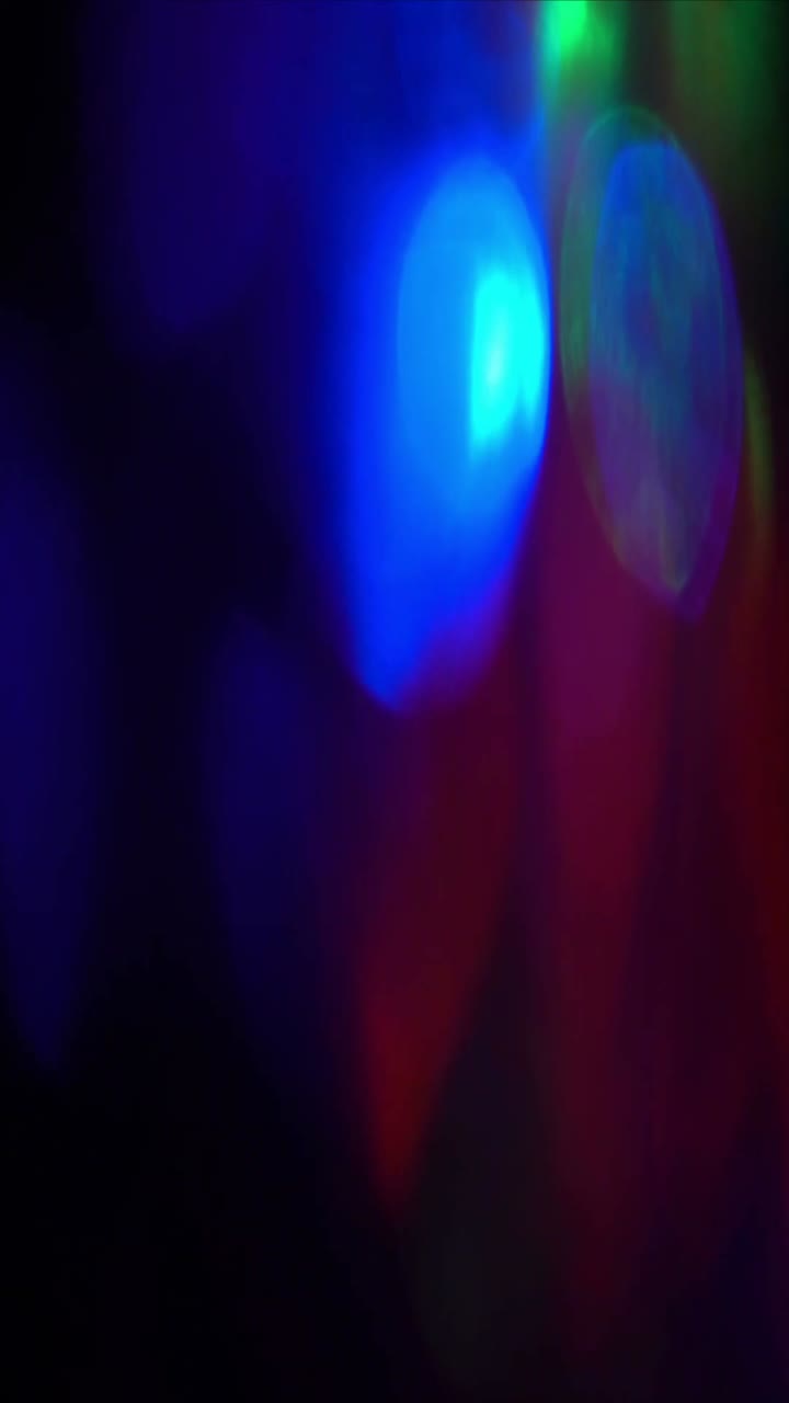 Abstract Colorful Light Leaks and Bokeh Effect on Dark Background