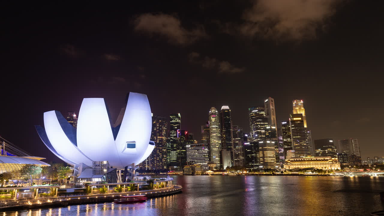 timelapse of the singapore city skyline with the lotus artscience building
