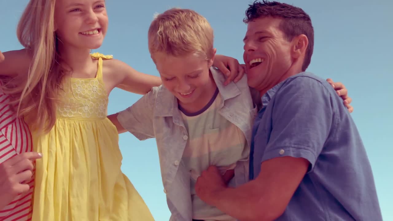 Parents tickling their children