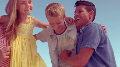 parents tickling their children