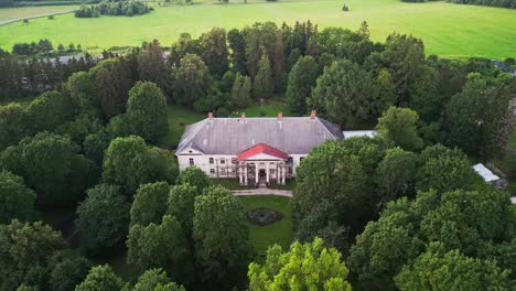 scenic drone footage of kirna manor highlights the historic estate in järva county estonia blending classical architecture with calm green landscapes often visited for cultural and wellness tourism