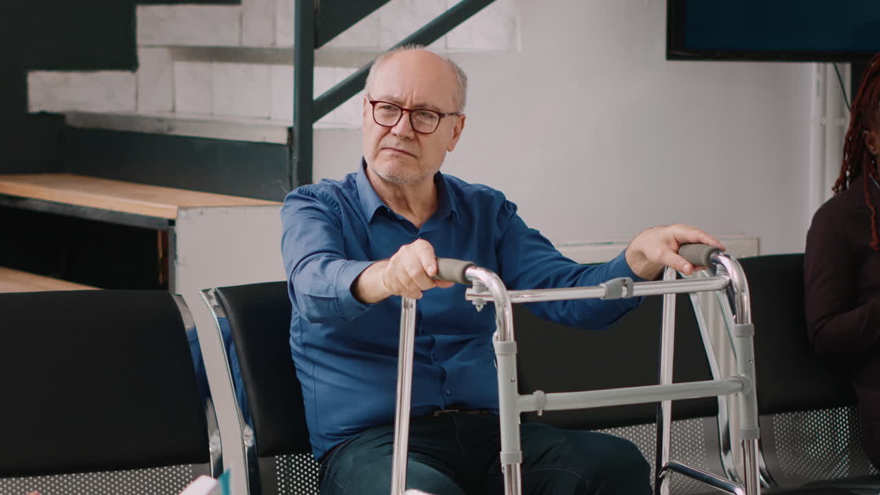 Old people waiting in hospital reception lobby