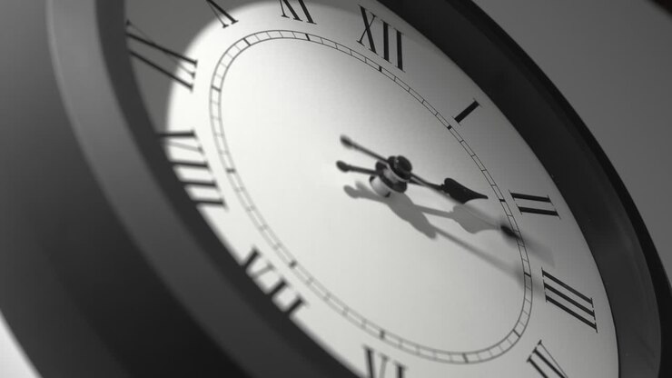 Latin Clock Face in Time Lapse on White Wall