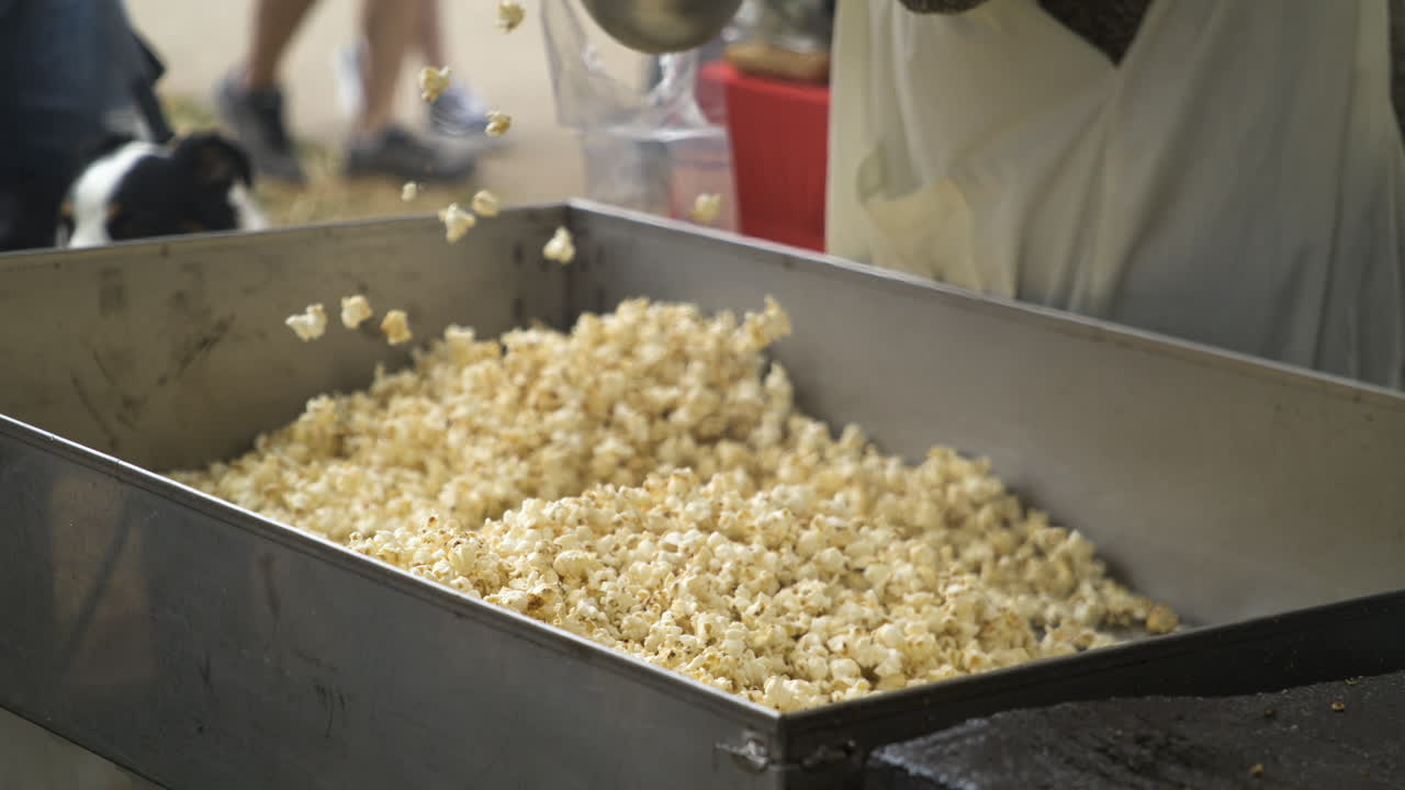 Food Vendor Scooping Kettle Corn Into Plastic Bag At 50th Dogwood Festival In Siloam Springs, Arkansas