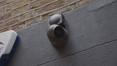 Close-Up-Of-Surveillance-Camera-Outside-Buildings-In-Mayfair-London-UK