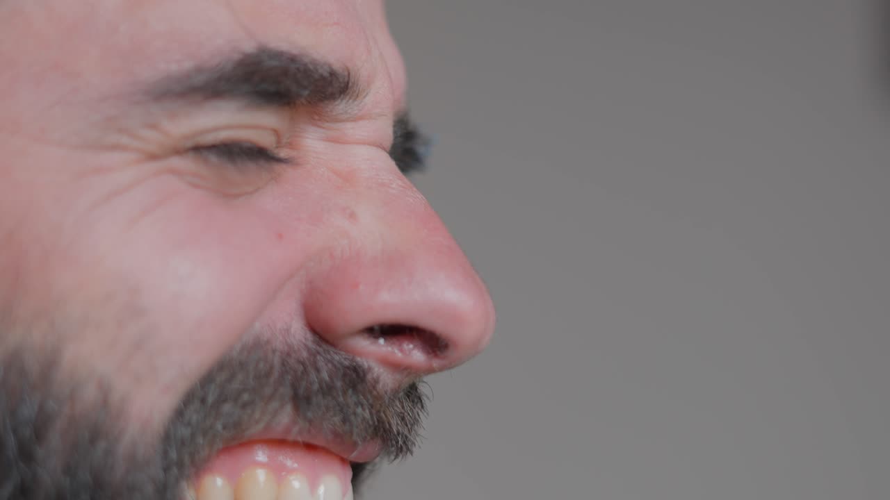 Man Singing/Talking into a Microphone