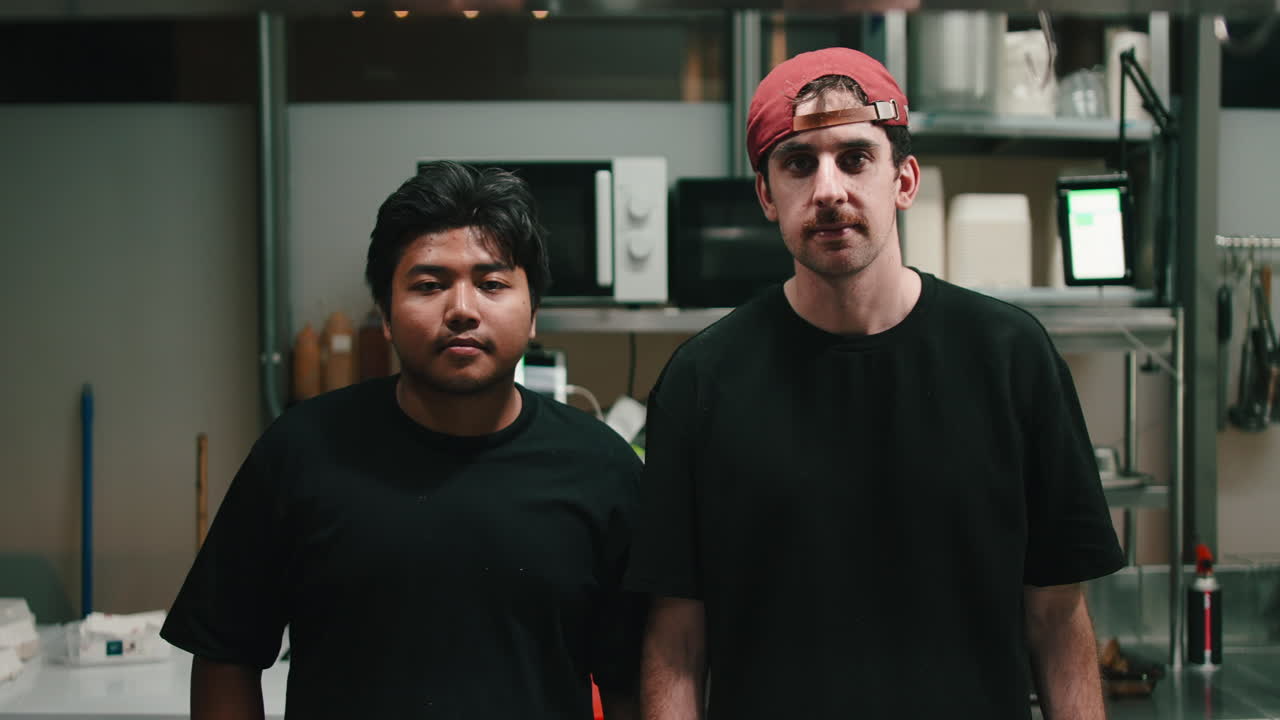 Two Men Posing in a Kitchen